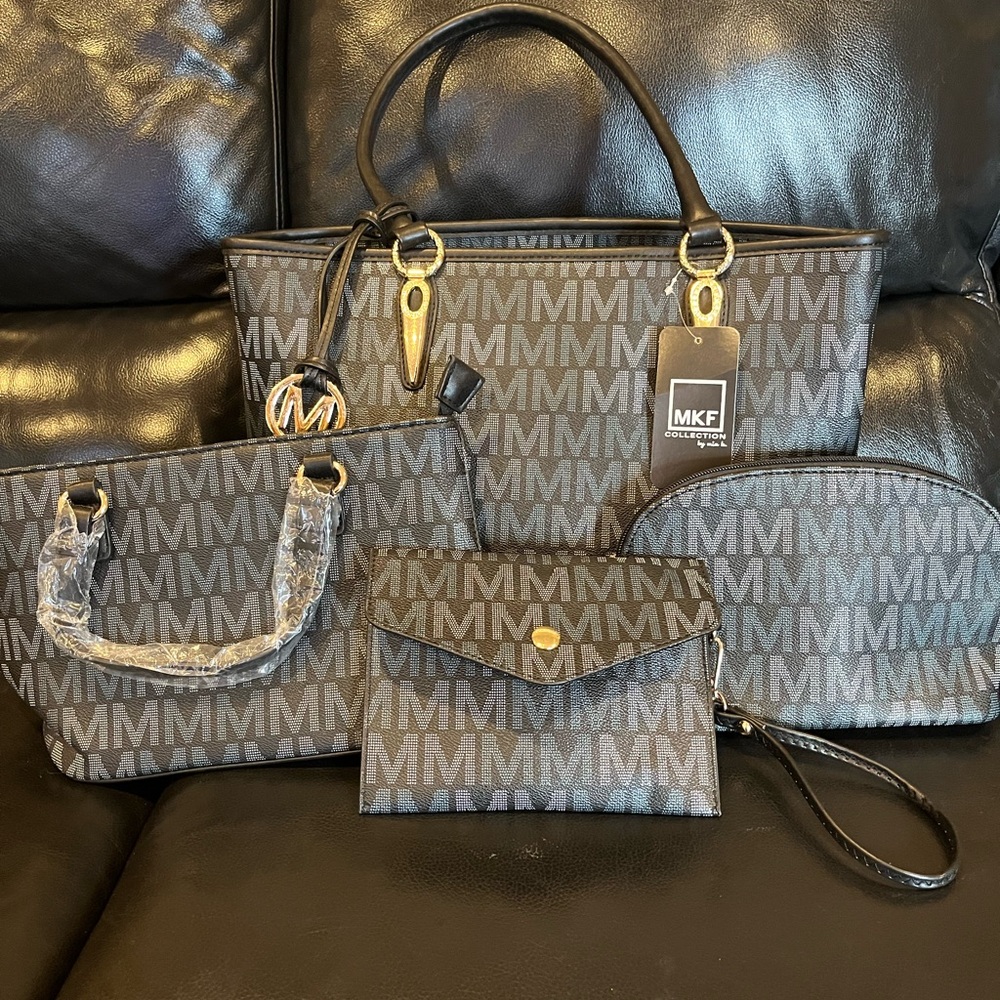 MKF bags set of 4. Black bags with the M’ white and blue. Never used.